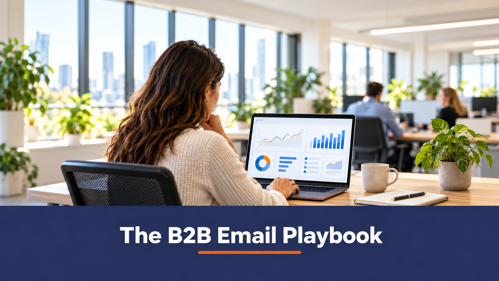 B2B email marketing guide featured image, a marketer reviewing email campaign dashboards on a laptop